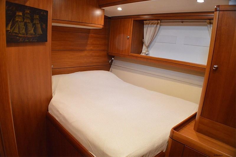 a bed in a room aboard TERRA DI MEZZO 3 Yacht for Charter