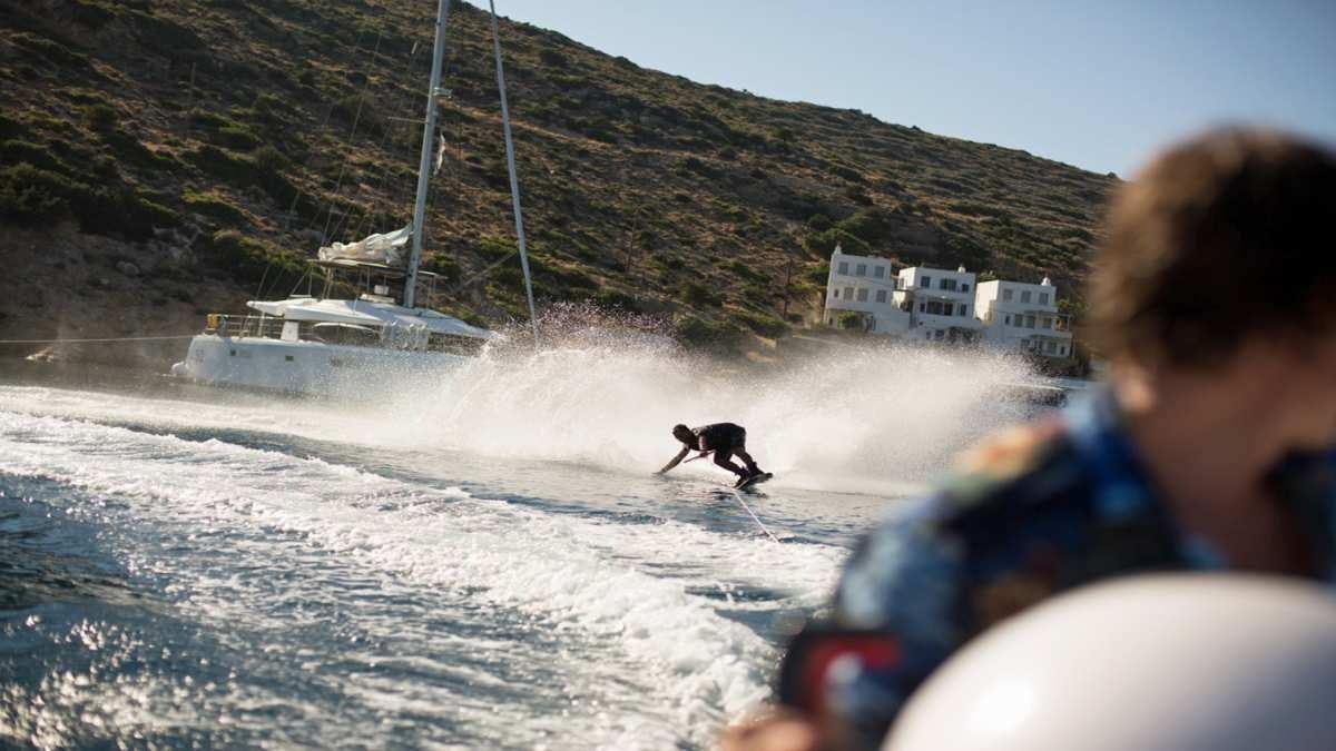 a dog running on snow aboard KEPI Yacht for Charter