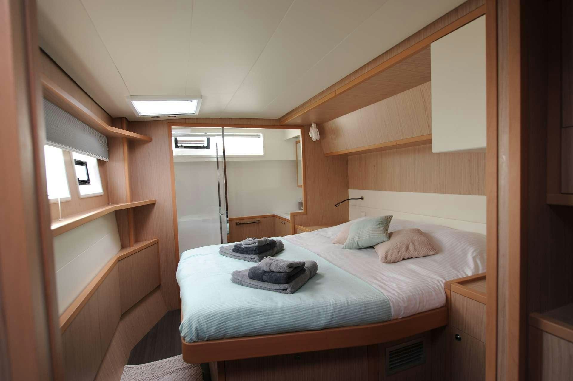 a bed in a room aboard KEPI Yacht for Charter
