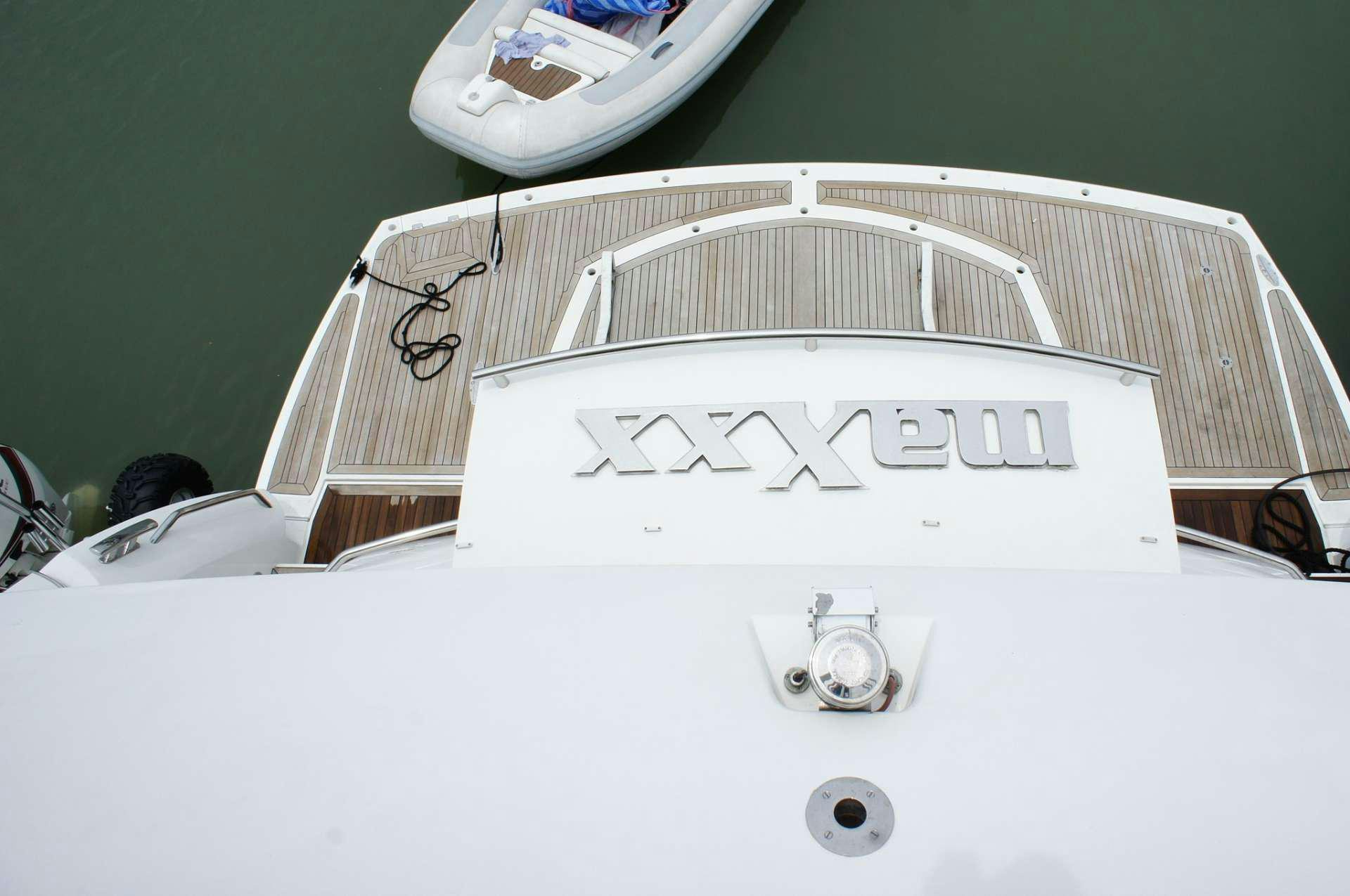 a white bed with a white sheet aboard SYDNEY Yacht for Charter