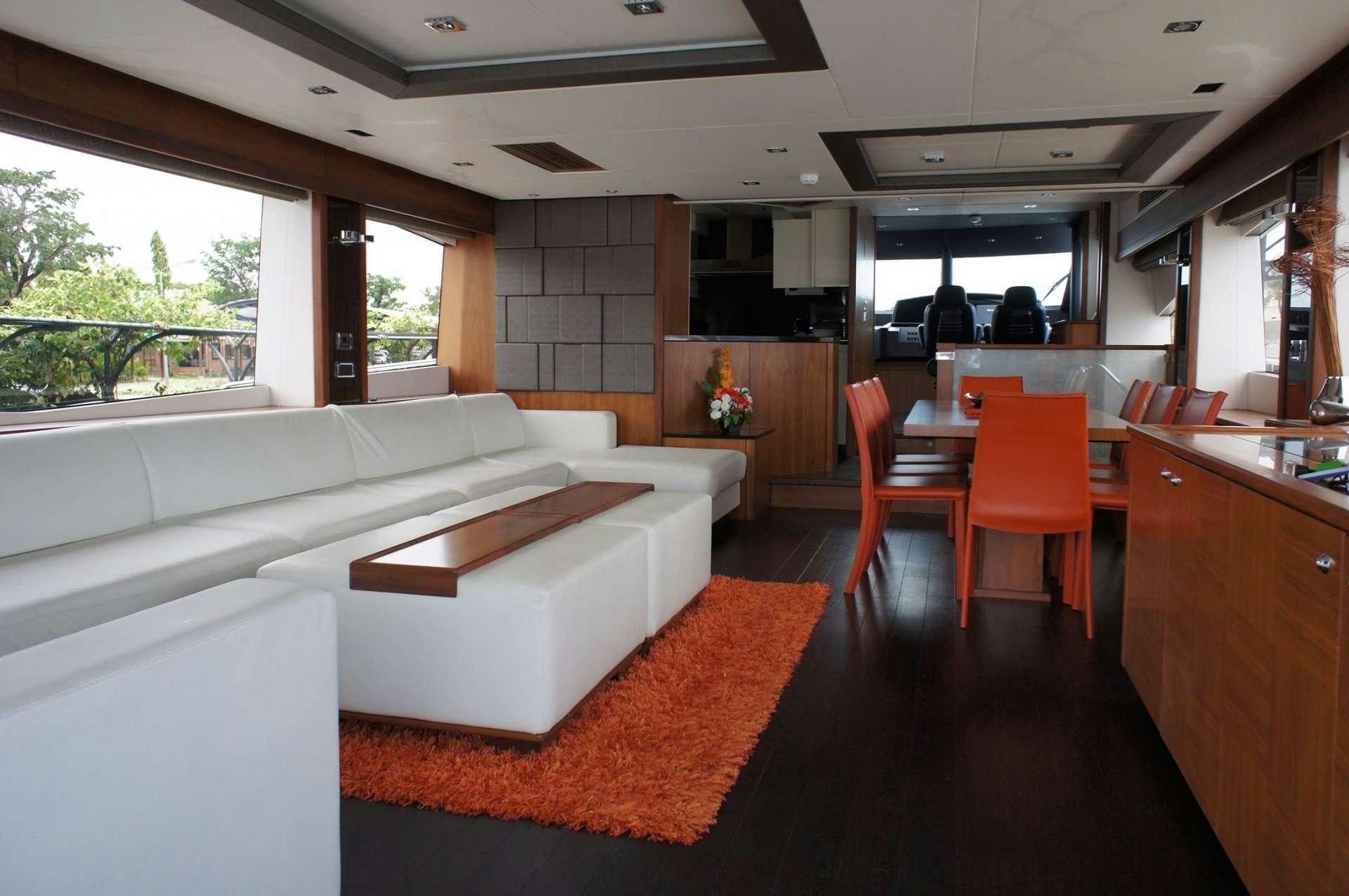 a living room with a couch and a table aboard SYDNEY Yacht for Charter