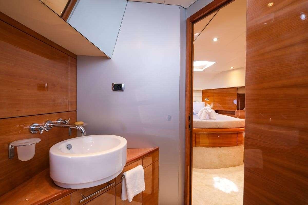a bathroom with a sink and a mirror aboard NOE Yacht for Charter