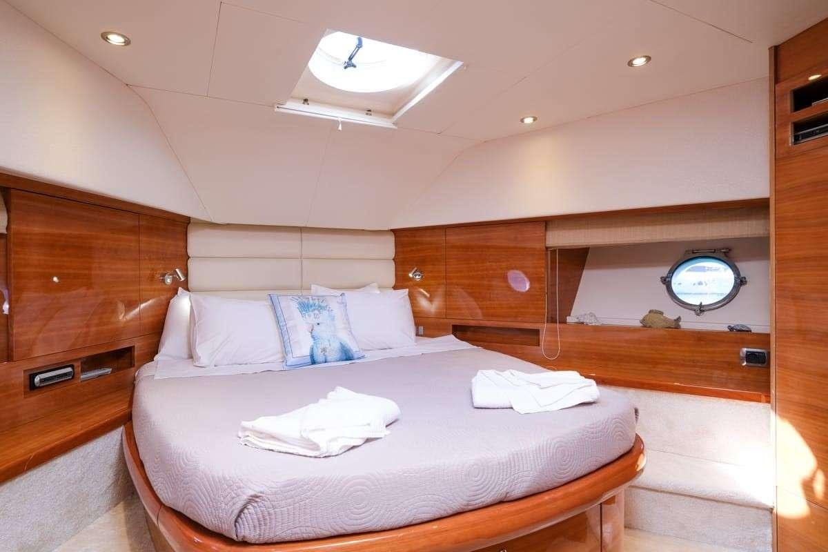 a bed in a cabin aboard NOE Yacht for Charter