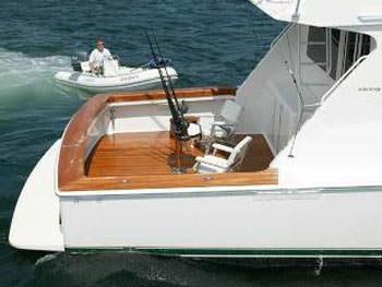 a person driving a boat aboard PRIORITY Yacht for Charter