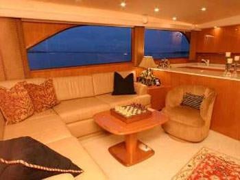 a living room with a large window aboard PRIORITY Yacht for Charter