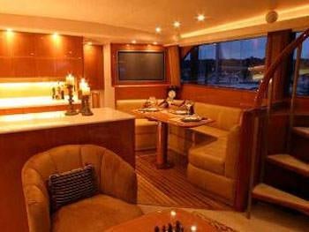 a living room with a fireplace aboard PRIORITY Yacht for Charter