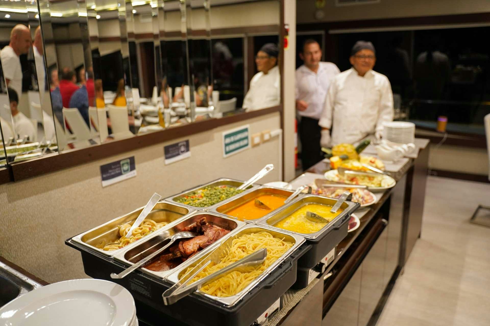 a buffet with food aboard GRAND MAJESTIC Yacht for Charter