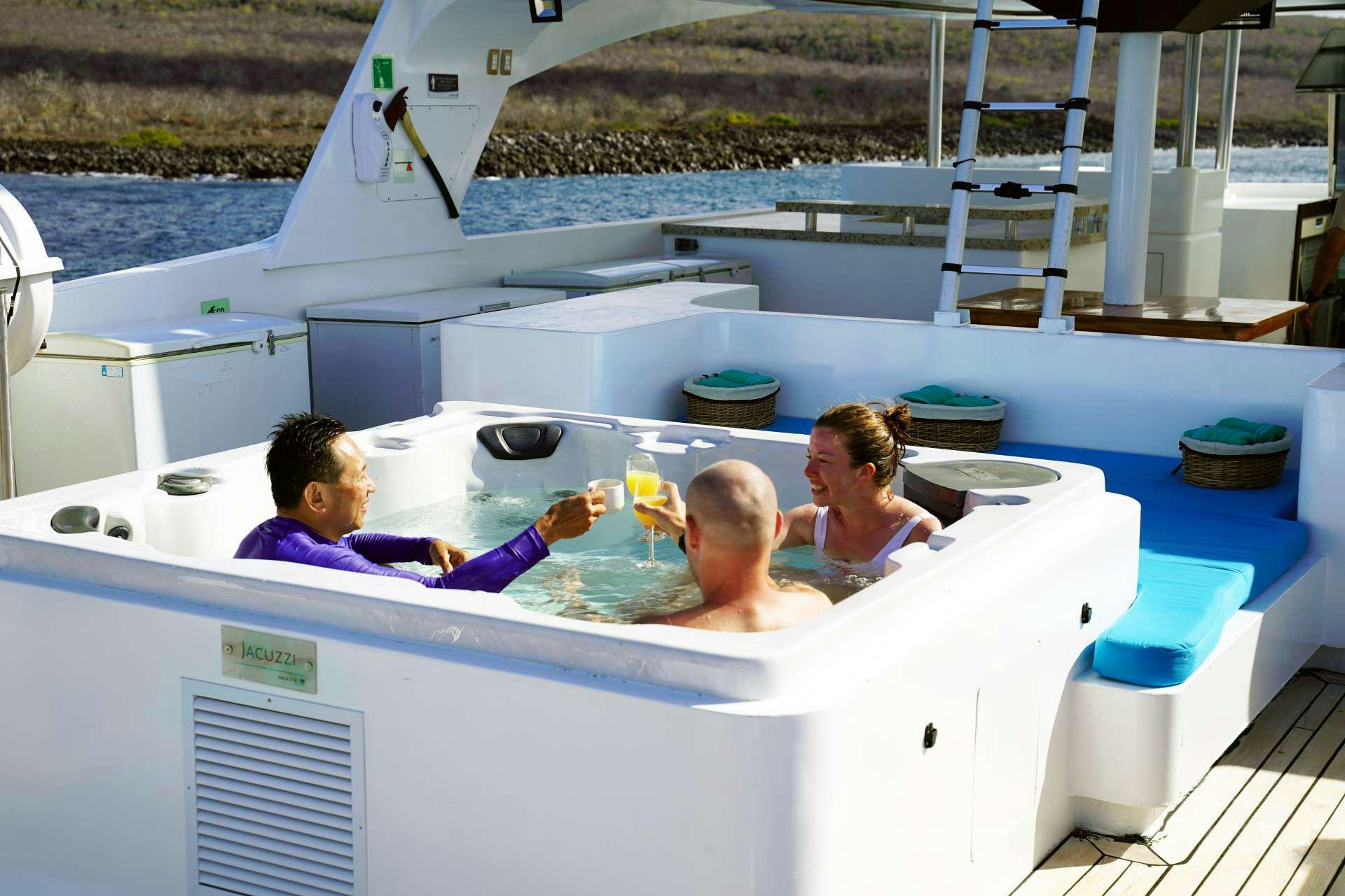 a group of people in a pool aboard GRAND MAJESTIC Yacht for Charter