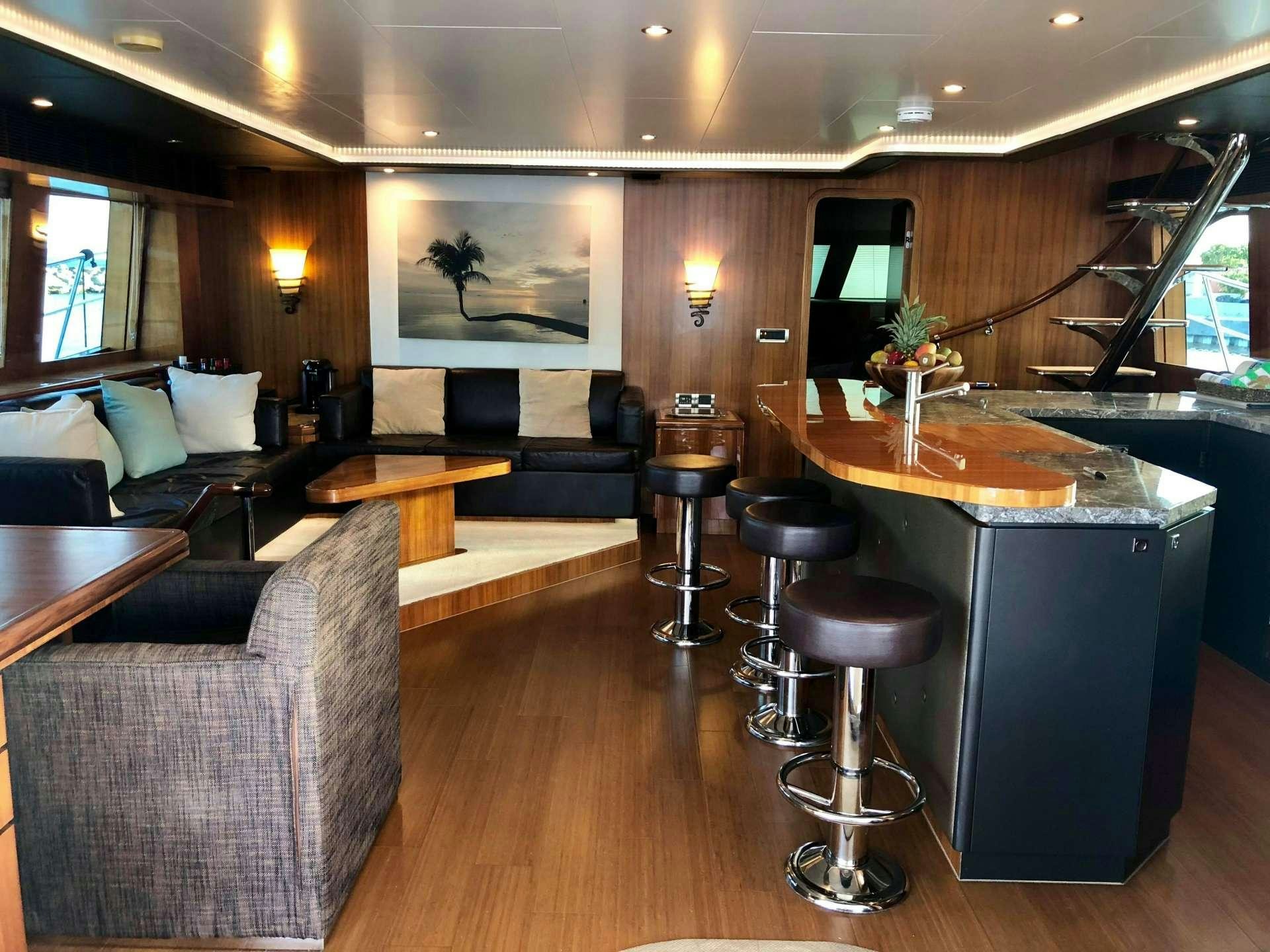 a room with a couch and a table and chairs aboard BLUE HORIZON Yacht for Charter