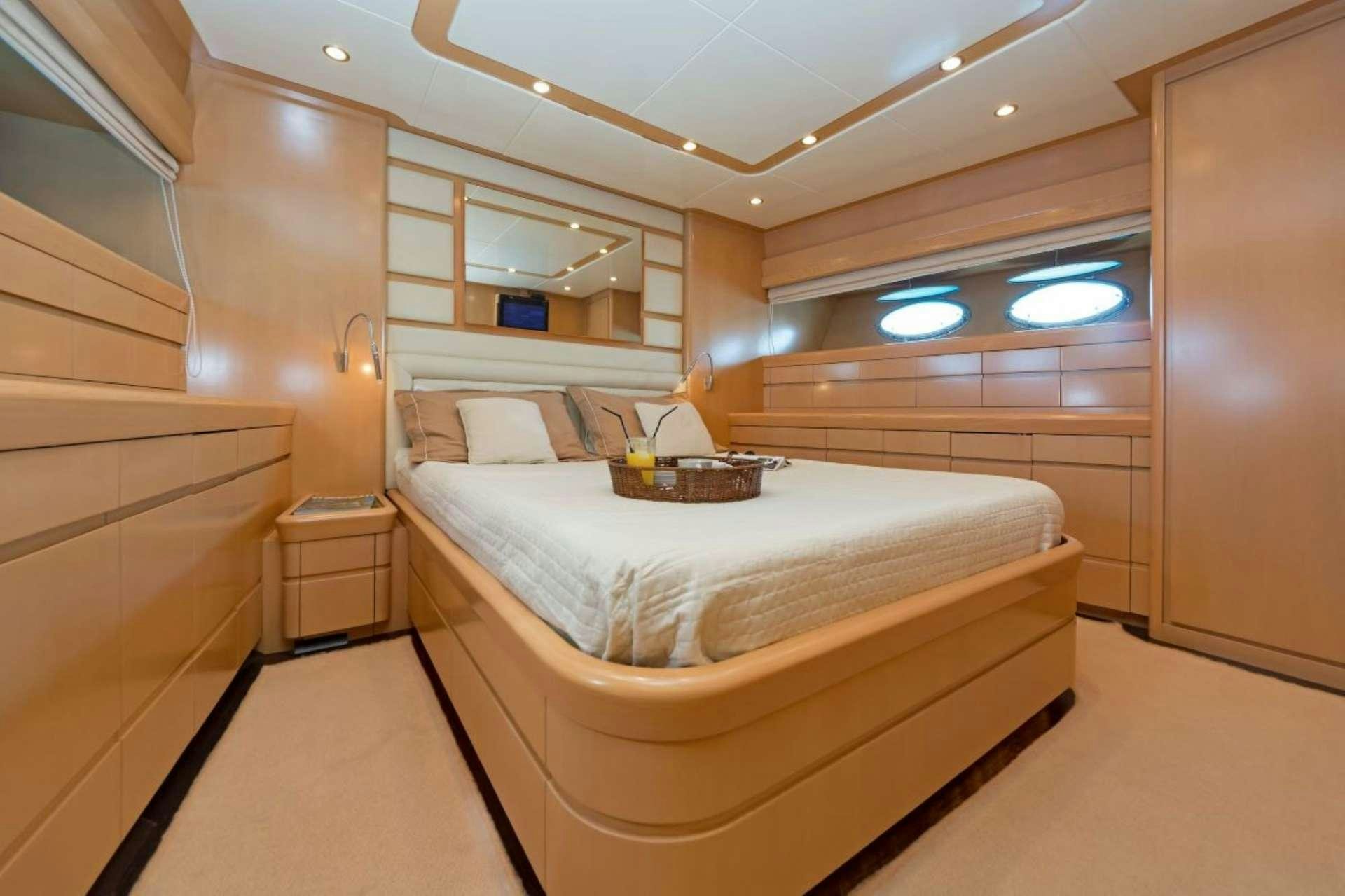 a room with a bed and a window aboard LETTOULI III Yacht for Charter