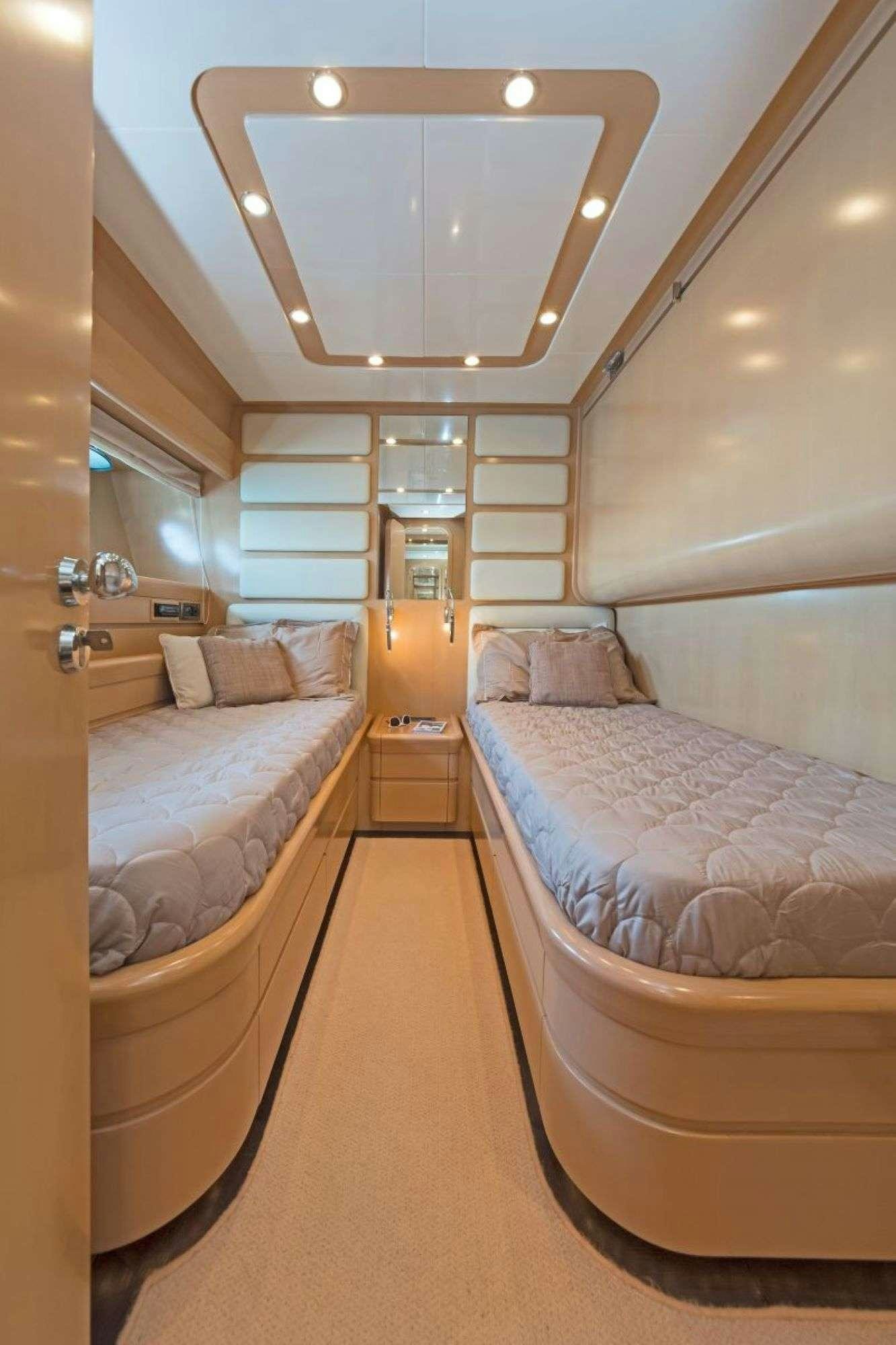 a room with two beds aboard LETTOULI III Yacht for Charter