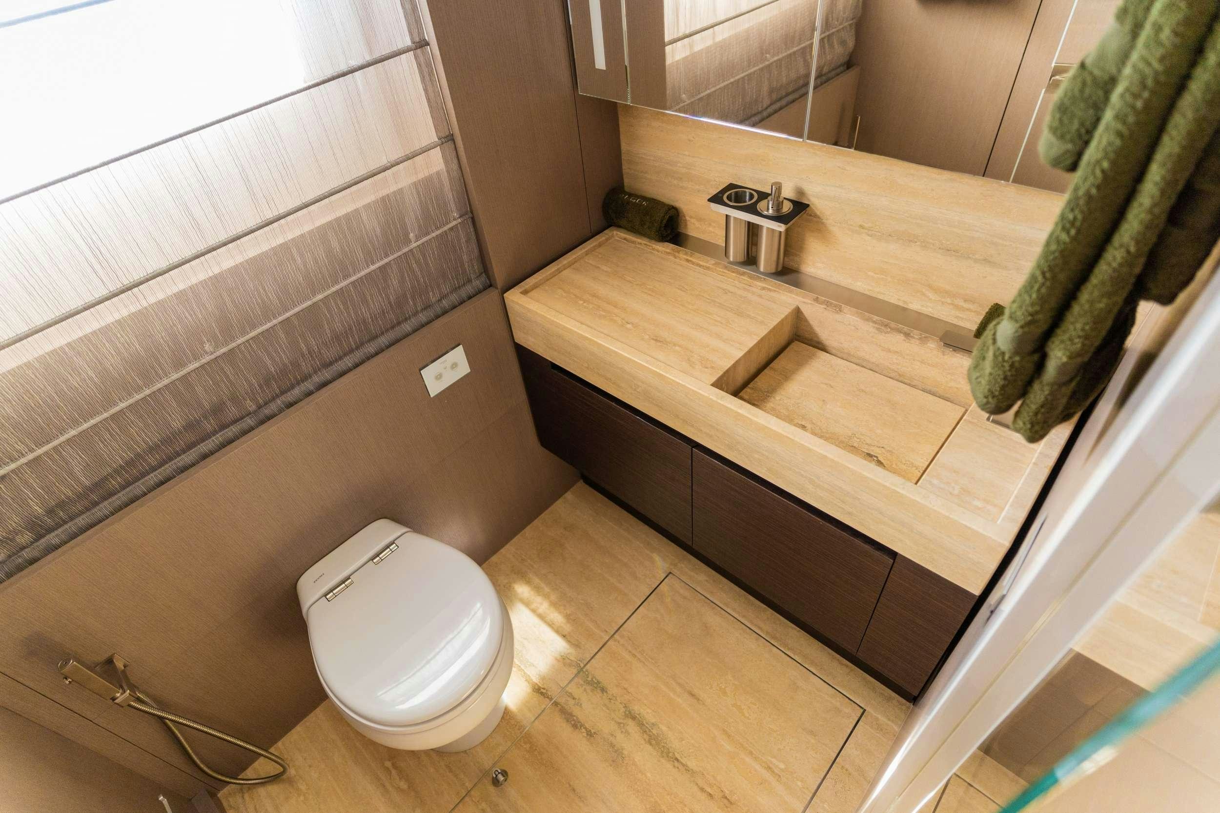 a bathroom with a sink and toilet aboard NOOR II Yacht for Charter