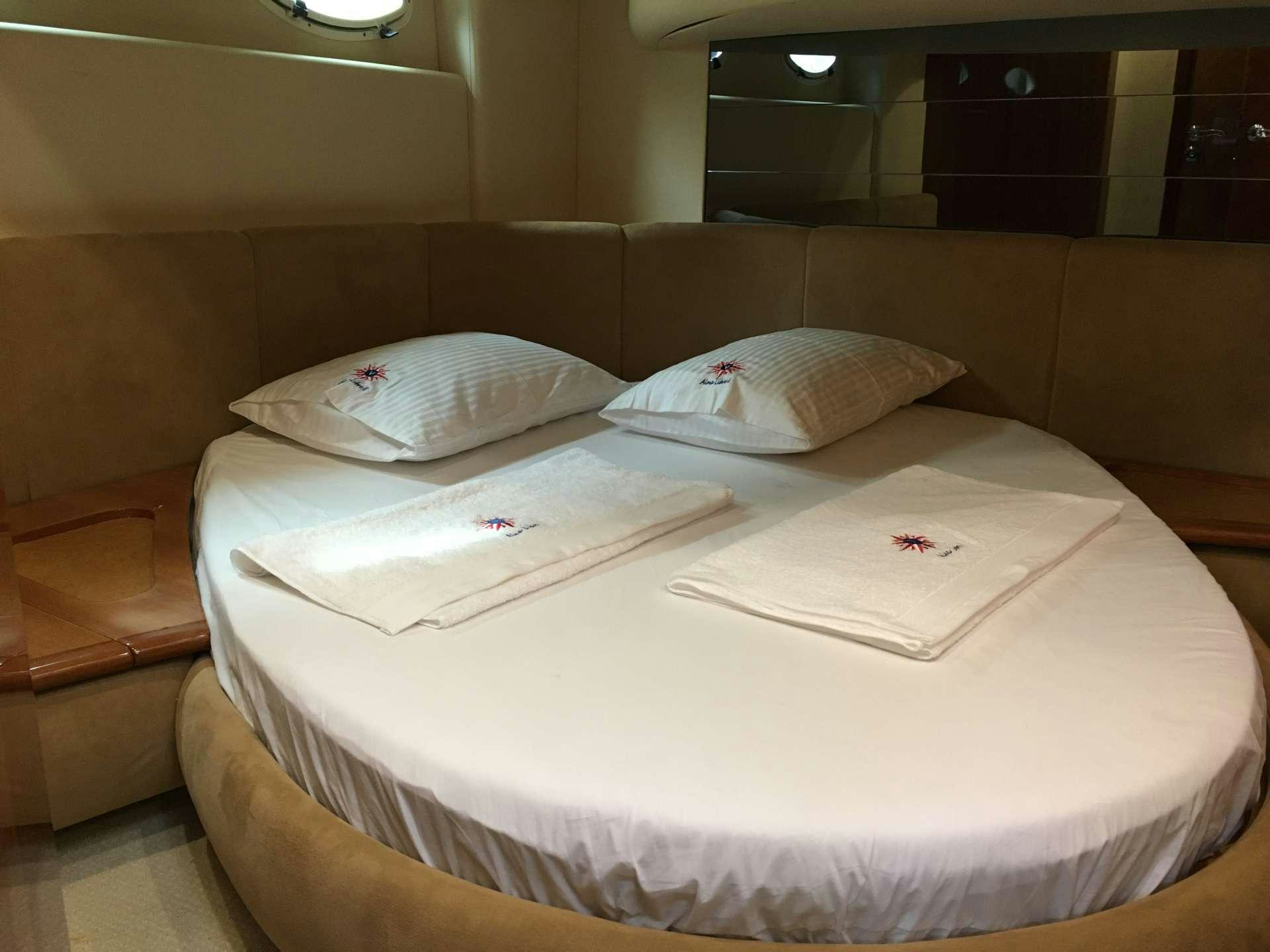 a couple of white pillows on a bed aboard ALMA LIBRE II Yacht for Charter