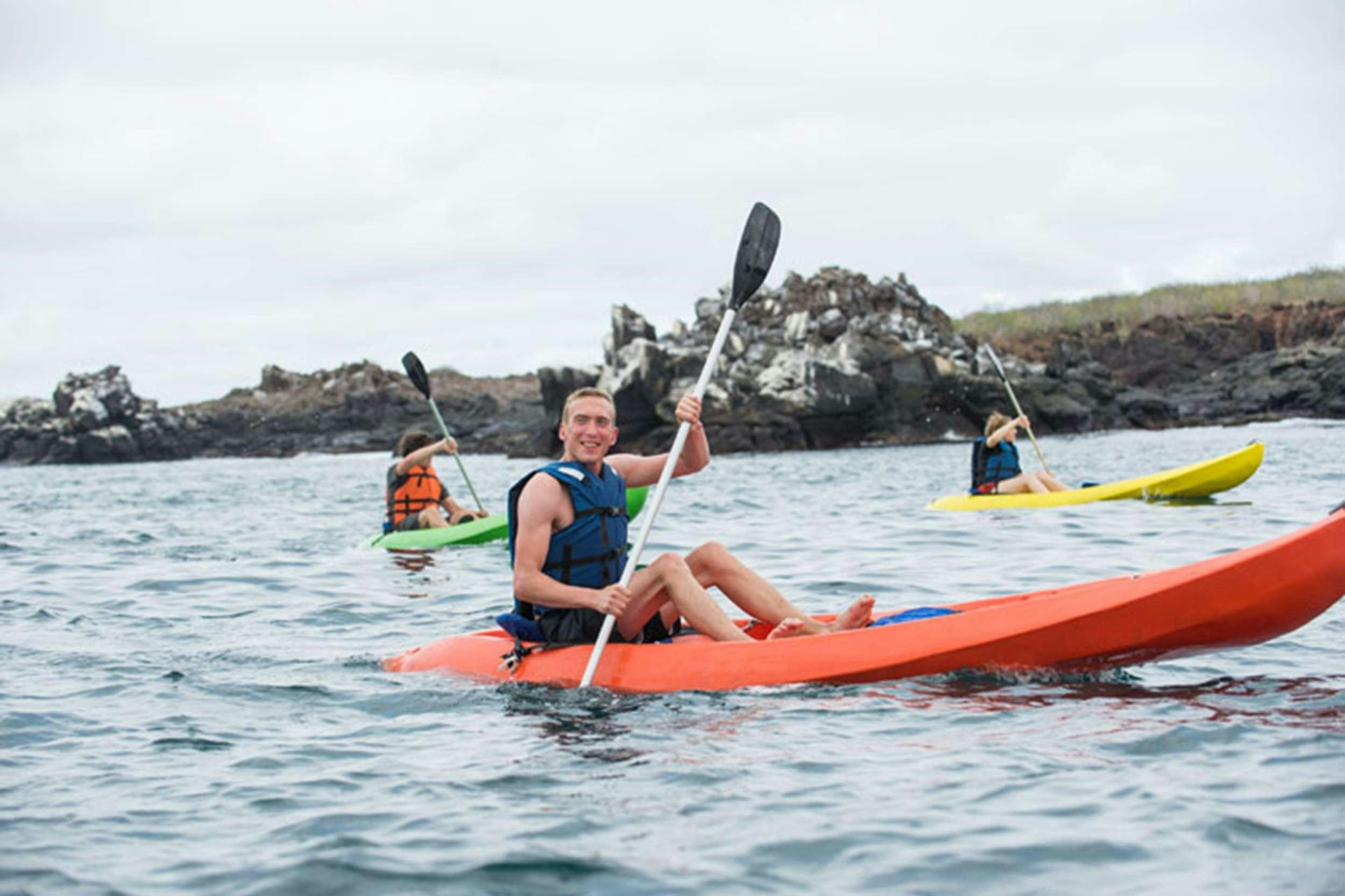 a group of people in kayaks aboard NATURAL PARADISE Yacht for Charter