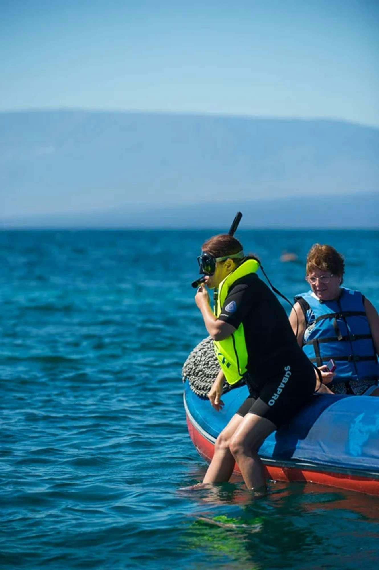 a person and a boy on a raft in the water aboard NATURAL PARADISE Yacht for Charter