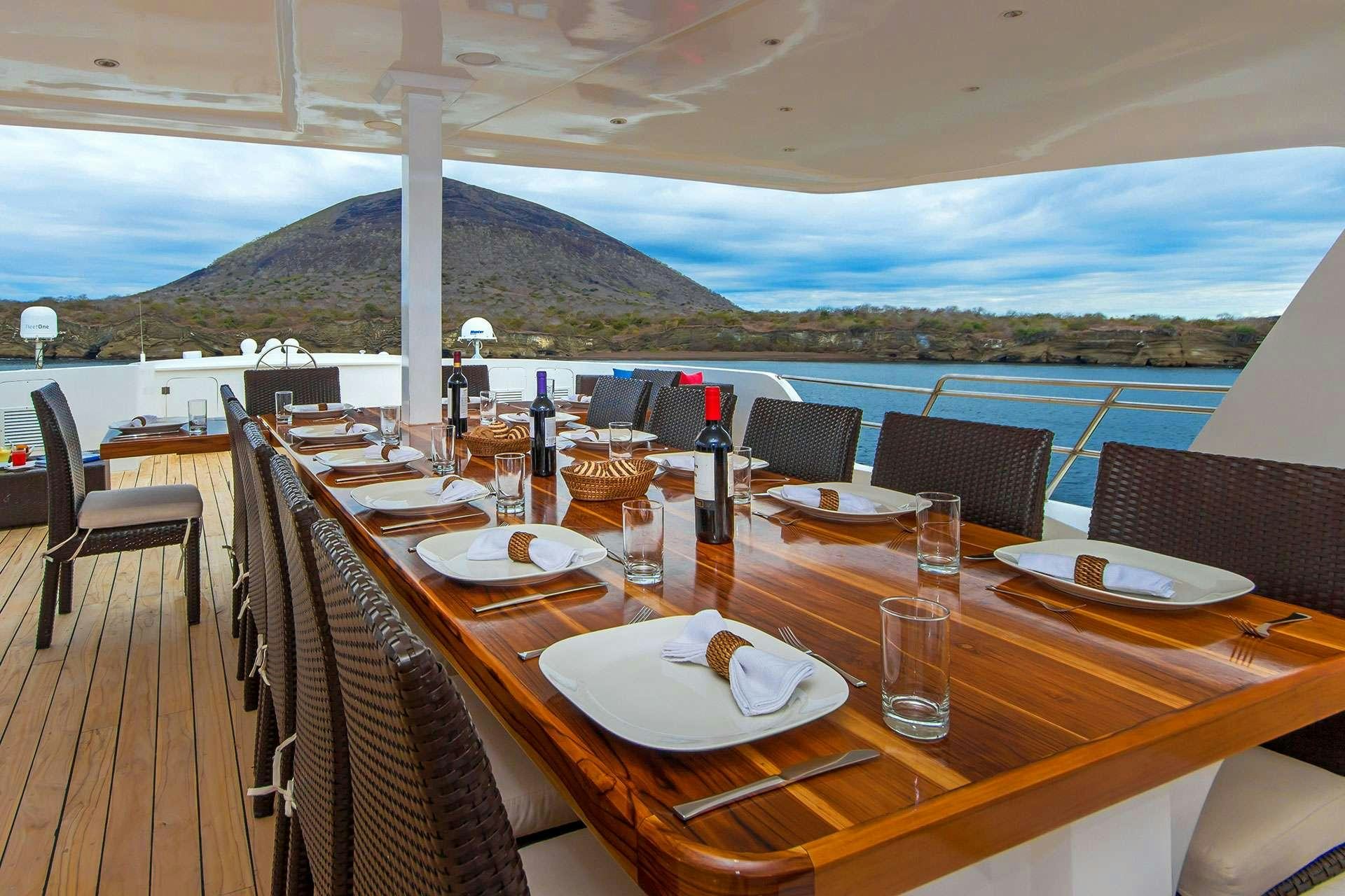 a table set for a meal aboard NATURAL PARADISE Yacht for Charter