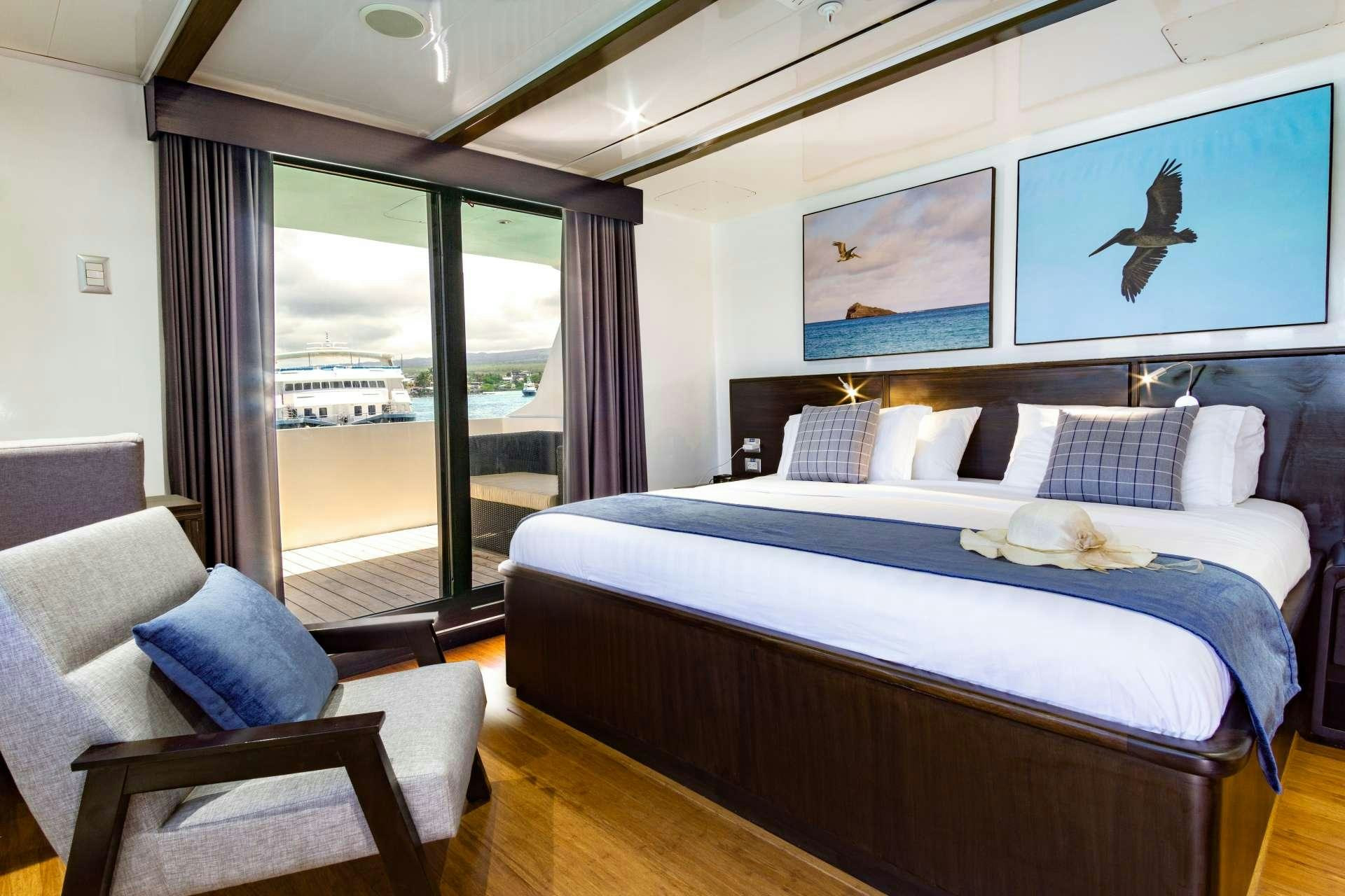 a bedroom with a large bed aboard NATURAL PARADISE Yacht for Charter