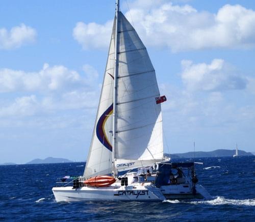 a sailboat on the water aboard CATALYST Yacht for Charter