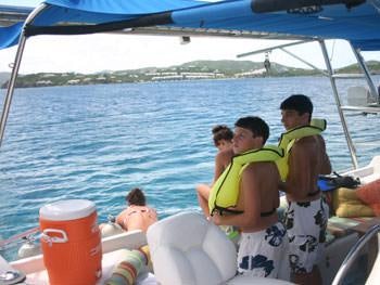 a group of people on a boat aboard CATALYST Yacht for Charter