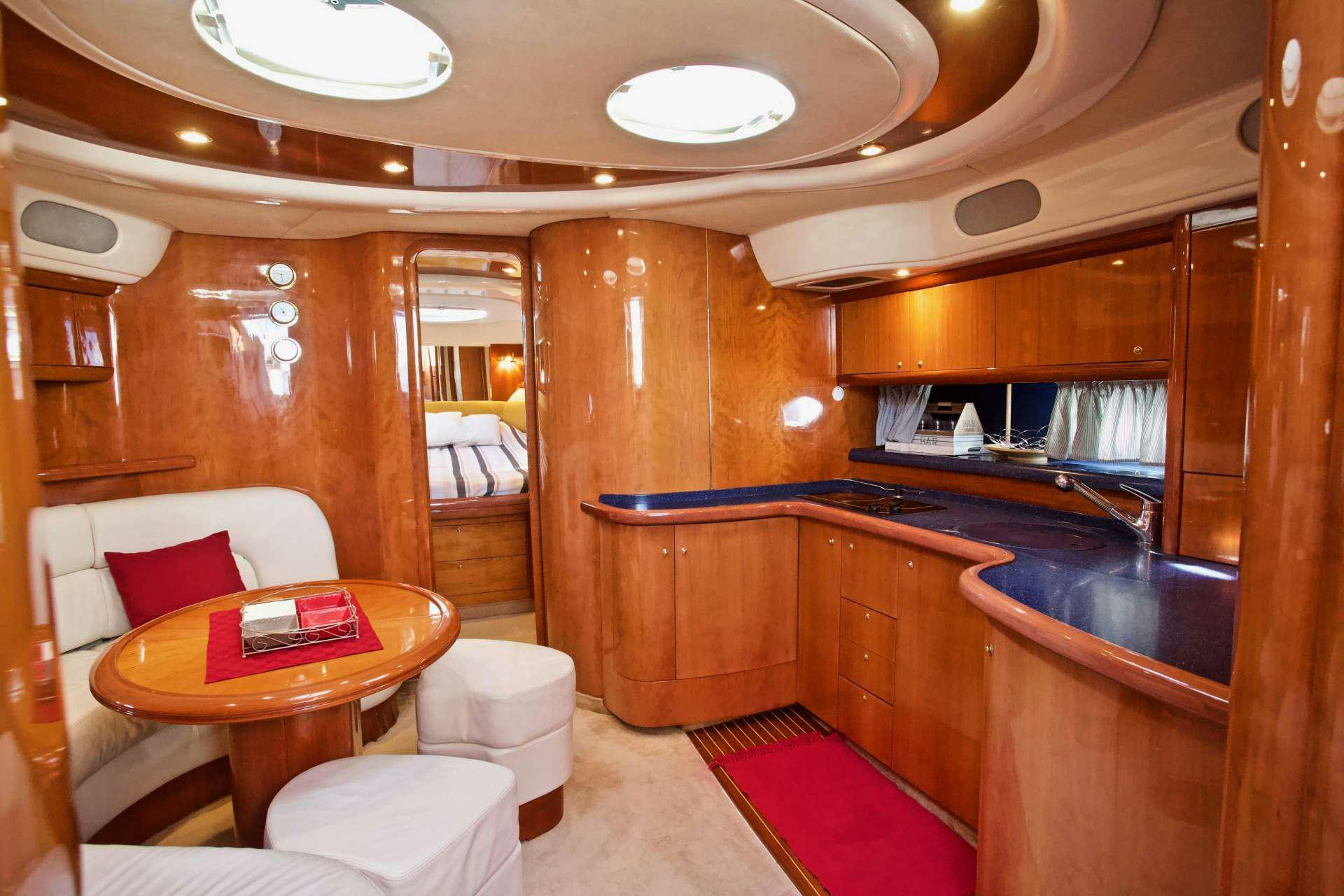 a room with a table and chairs aboard MAGIA Yacht for Charter