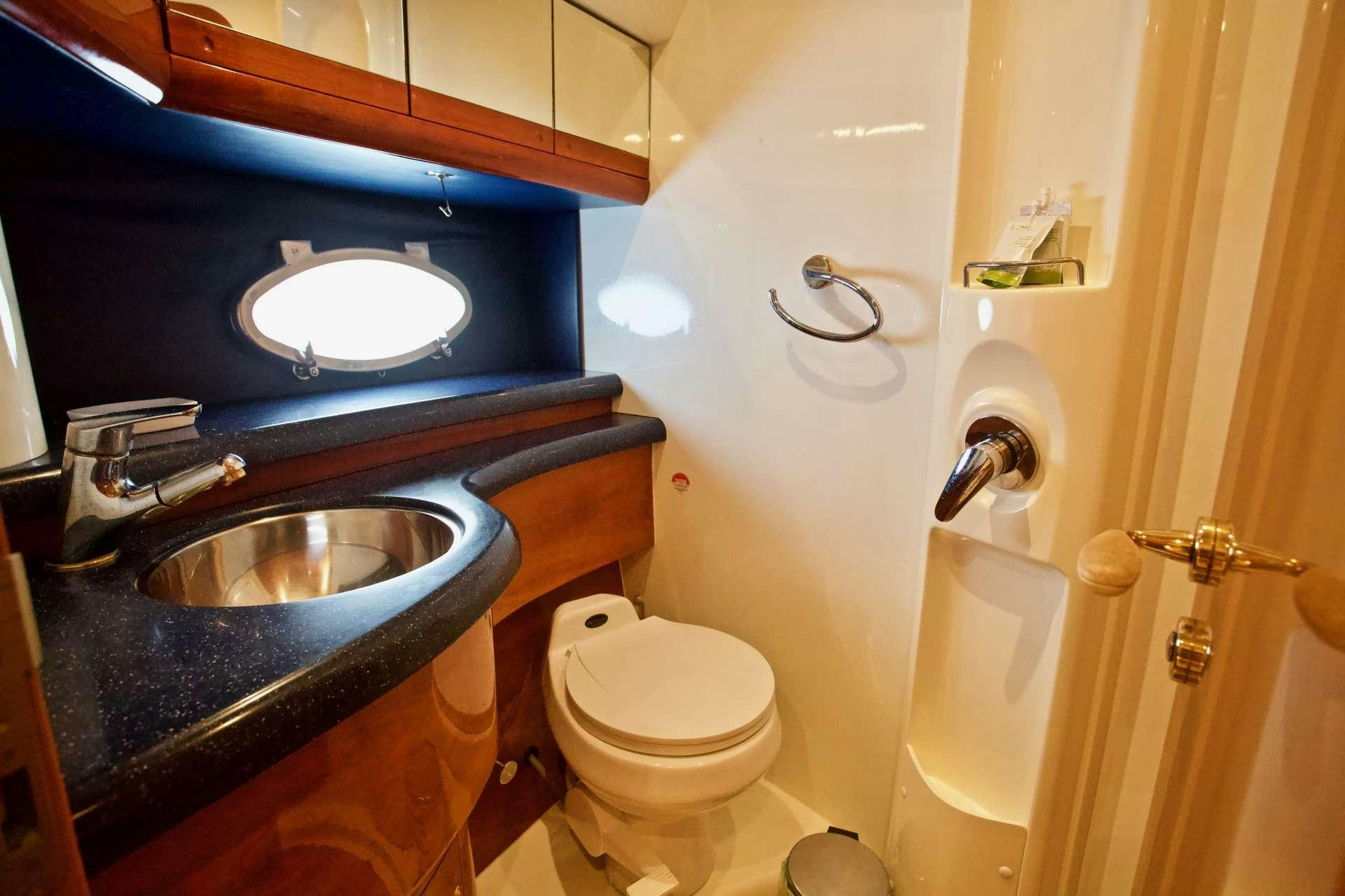 a bathroom with a sink toilet and a bathtub aboard MAGIA Yacht for Charter