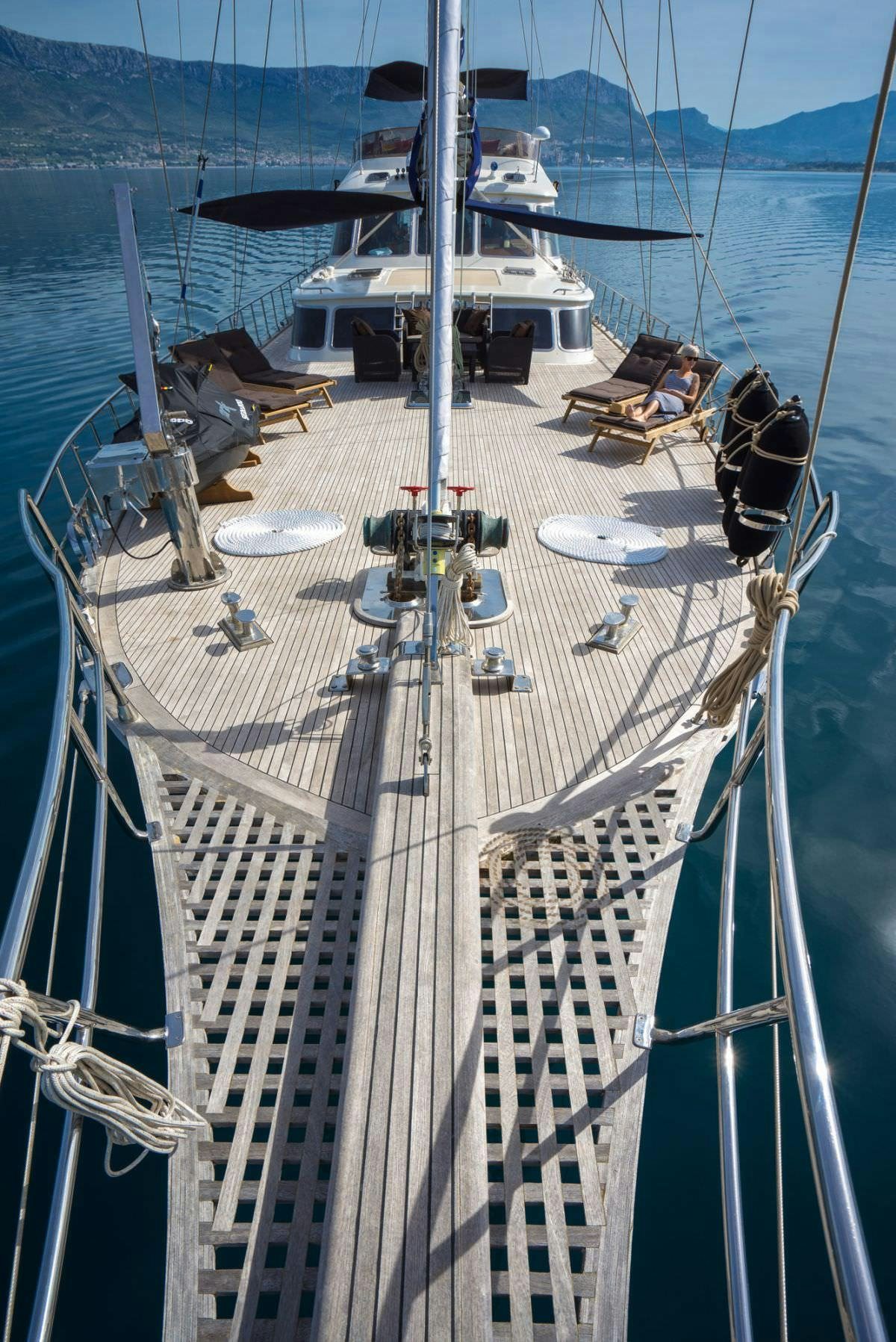 a large white boat with many boats aboard ALBA Yacht for Charter
