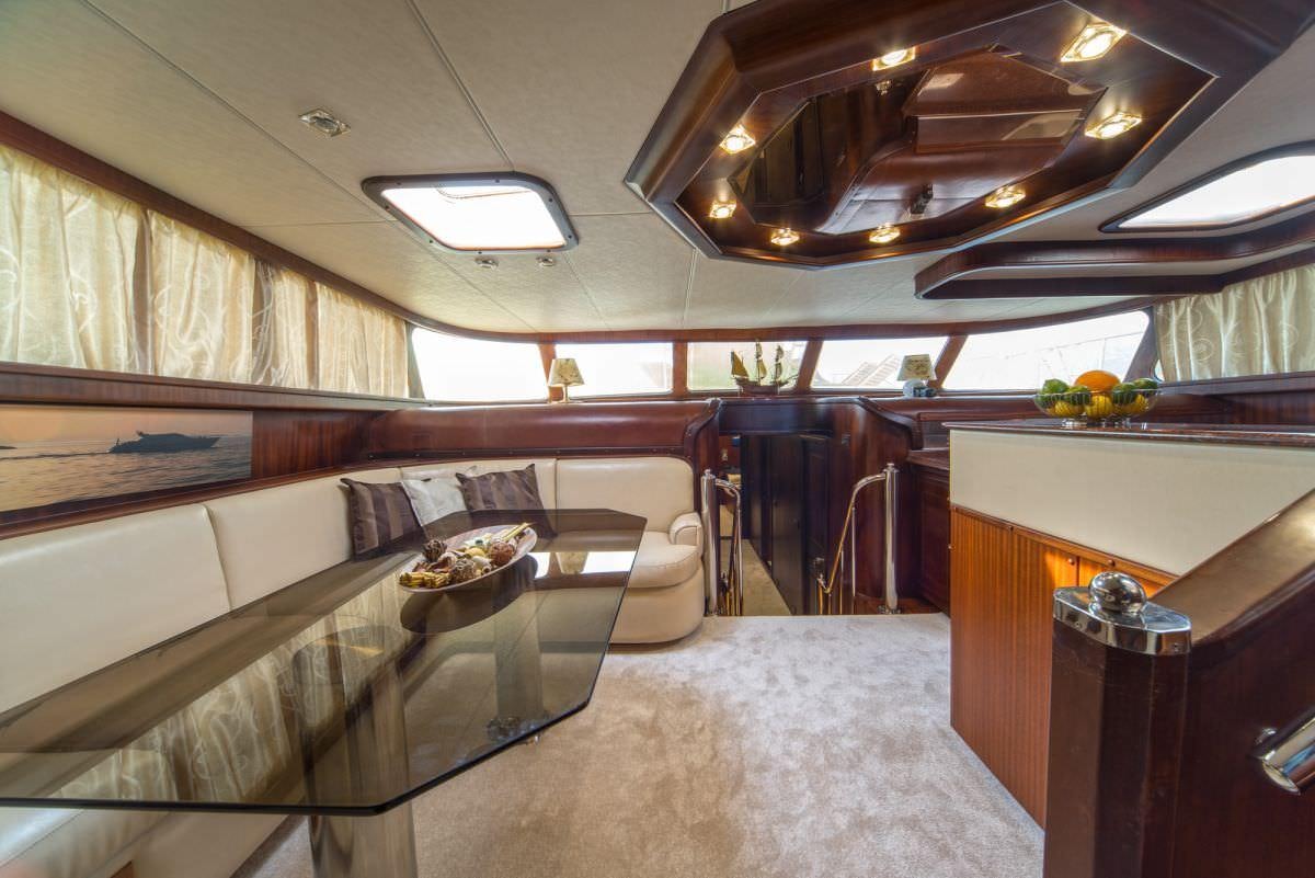 a room with a couch and a table aboard ALBA Yacht for Charter