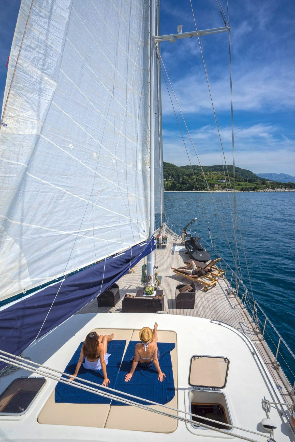 a couple of people sitting on a boat in the water aboard ALBA Yacht for Charter