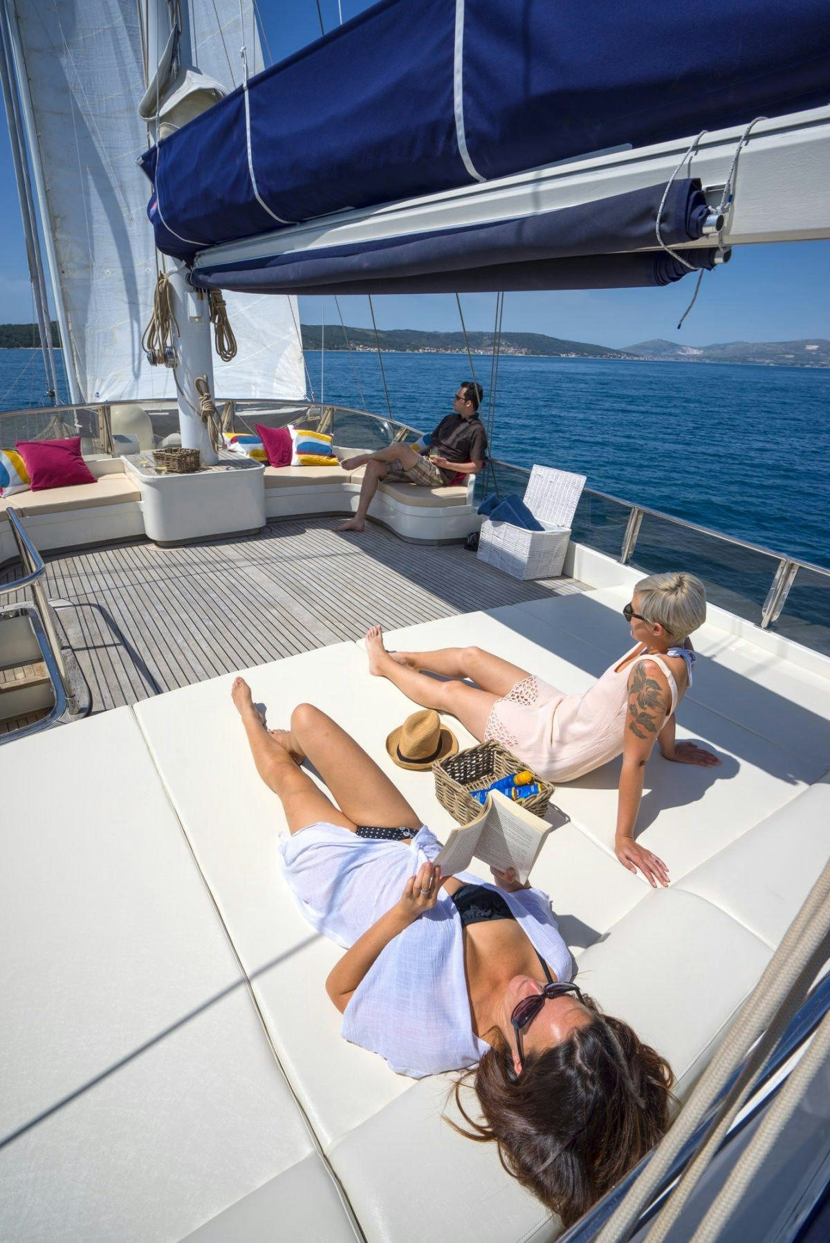 a group of people on a deck aboard ALBA Yacht for Charter