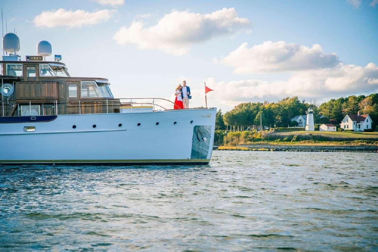 a couple people on a boat aboard BB Yacht for Charter