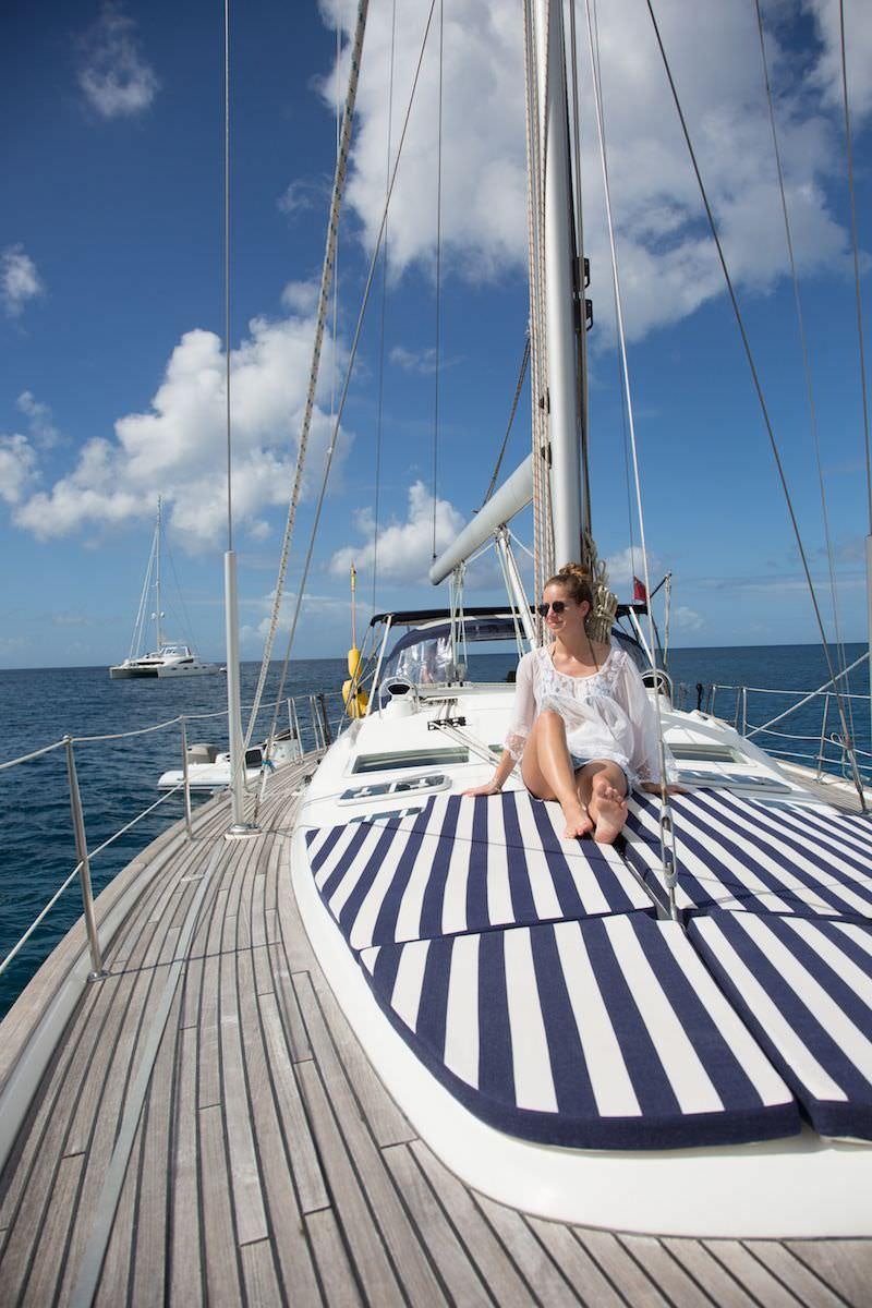 a person sitting on a boat aboard HALF TIDY Yacht for Charter