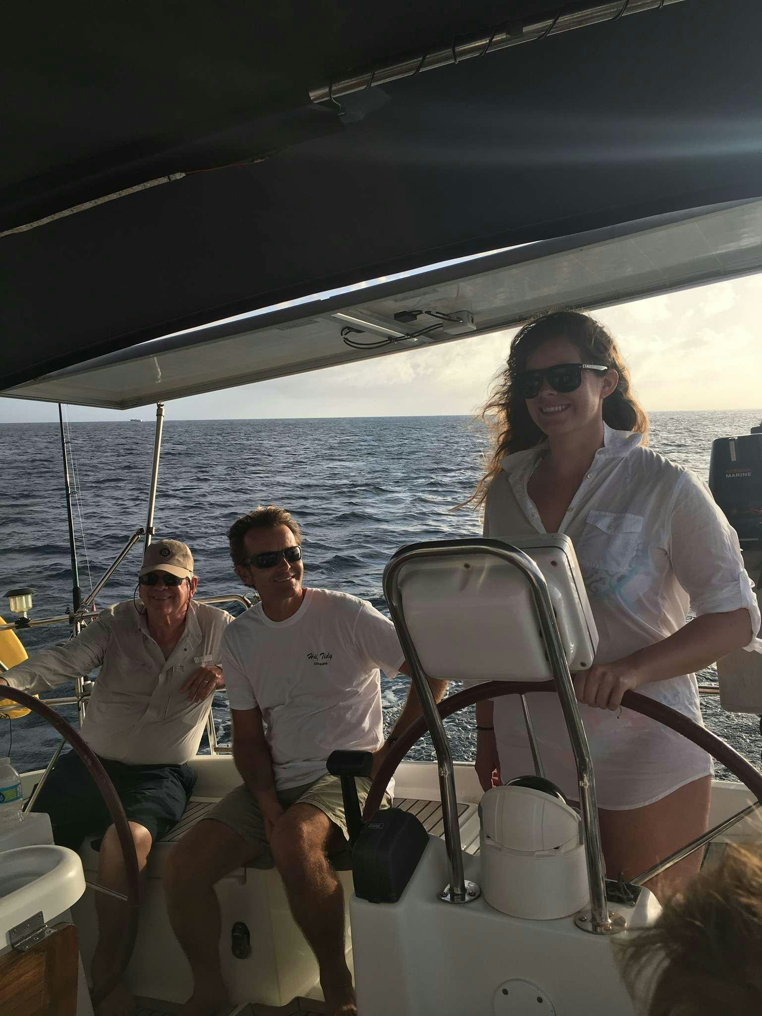 a group of people on a boat aboard HALF TIDY Yacht for Charter