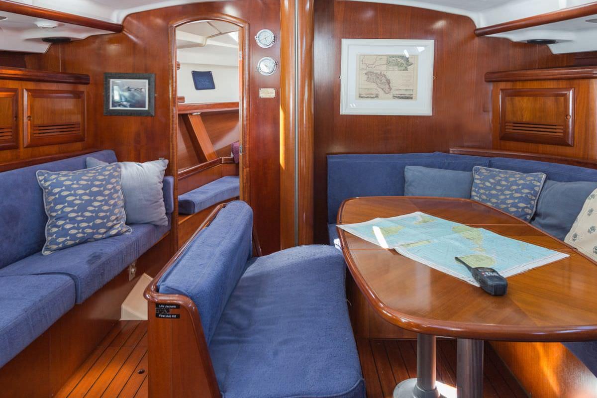 a living room with a couch and a table aboard HALF TIDY Yacht for Charter