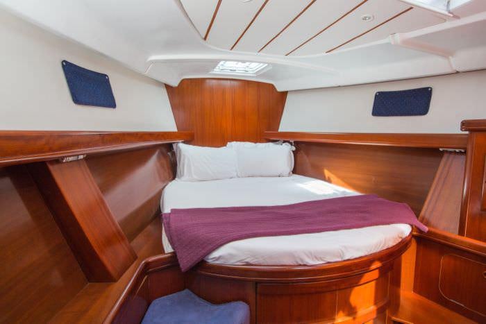 a couple of beds in a room aboard HALF TIDY Yacht for Charter