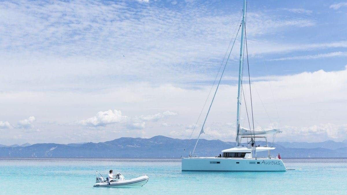 a couple of boats in the water aboard LAGOON 52 Yacht for Charter