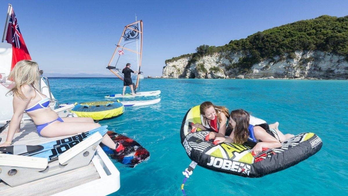 a group of people on a boat aboard LAGOON 52 Yacht for Charter