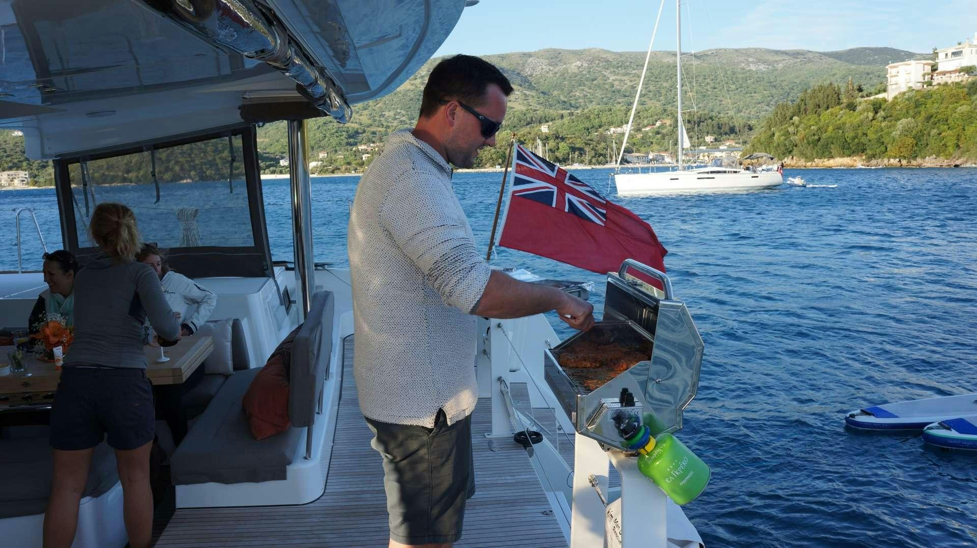 a person standing on a boat aboard LAGOON 52 Yacht for Charter