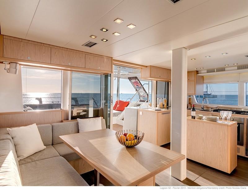 a modern looking kitchen and living room aboard LAGOON 52 Yacht for Charter