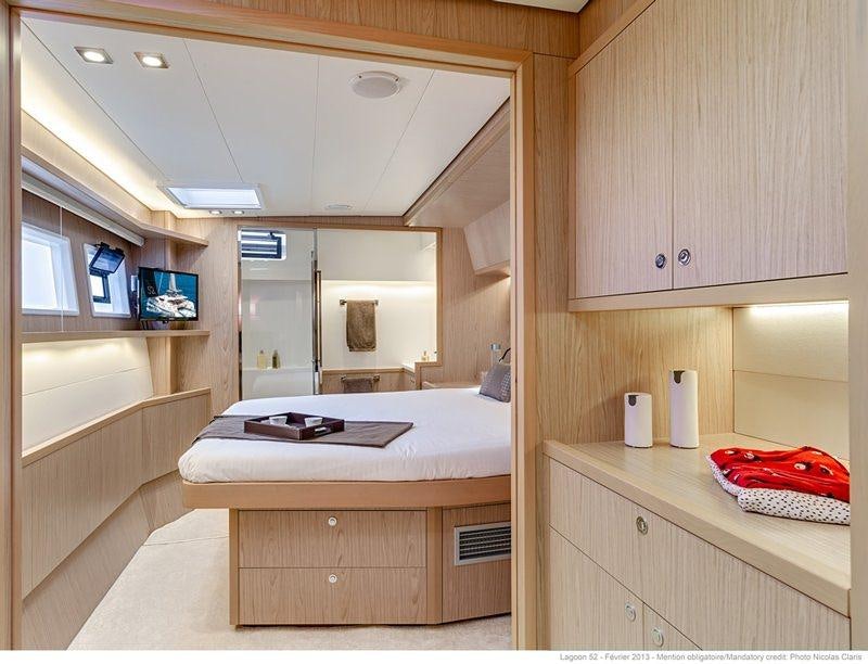 a bedroom with a bed aboard LAGOON 52 Yacht for Charter