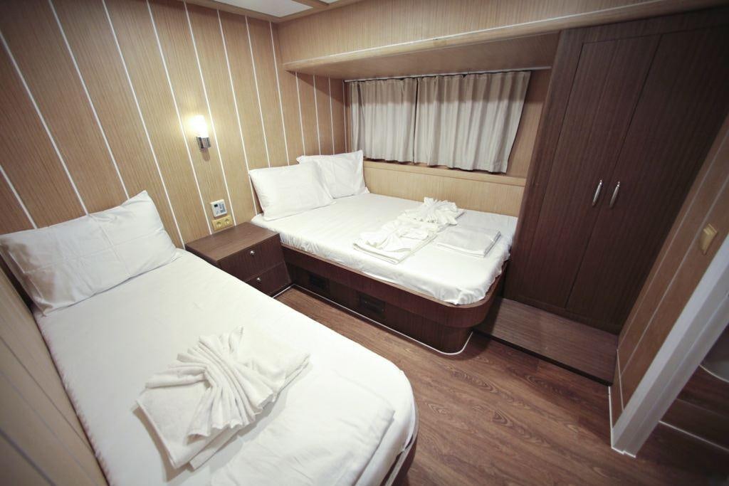 a room with two beds aboard OGUZBEY Yacht for Charter