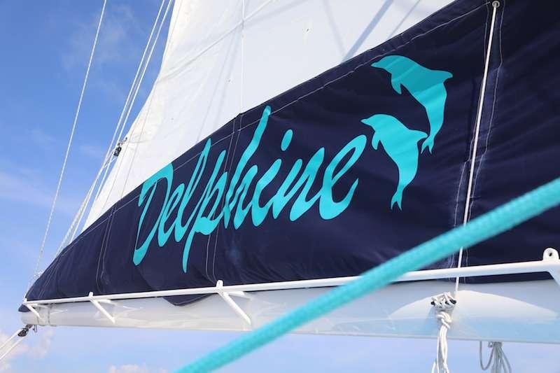 a flag with a person's legs on it aboard DELPHINE Yacht for Charter
