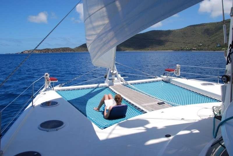a person sitting on a boat aboard DELPHINE Yacht for Charter