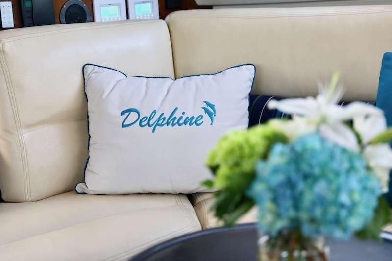 a flower on a couch aboard DELPHINE Yacht for Charter