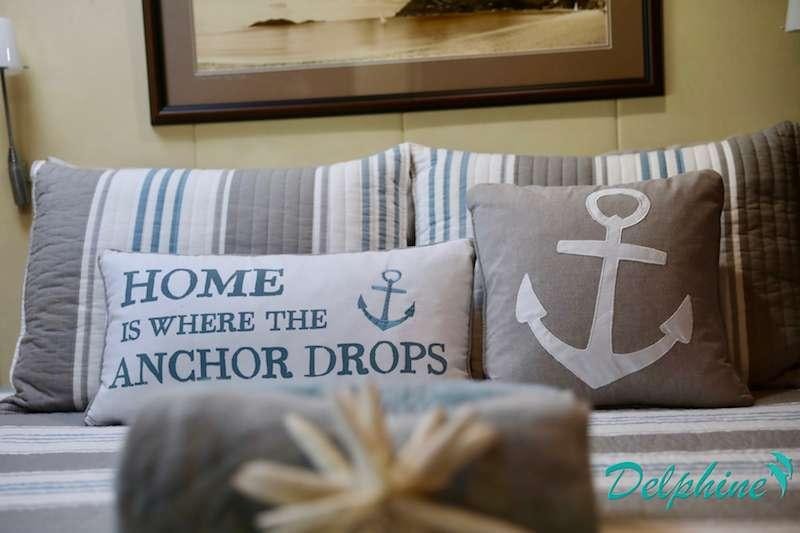 a couch with pillows aboard DELPHINE Yacht for Charter