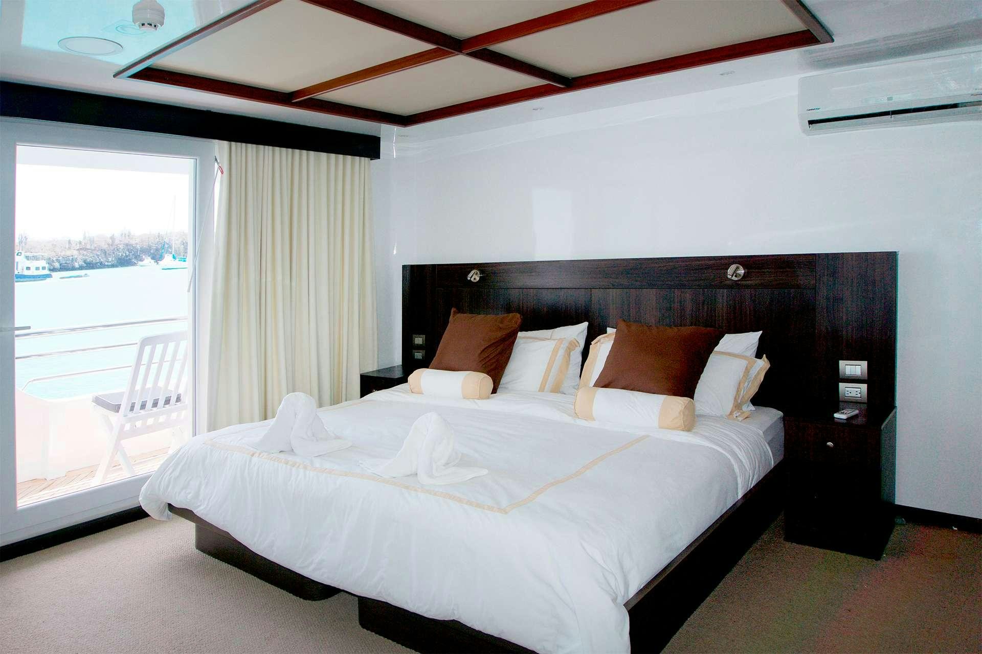 a bedroom with a large bed aboard CORMORANT Yacht for Charter