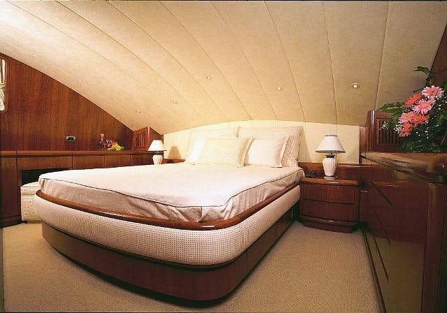 a bed in a room aboard ABSOLUTE KING Yacht for Charter