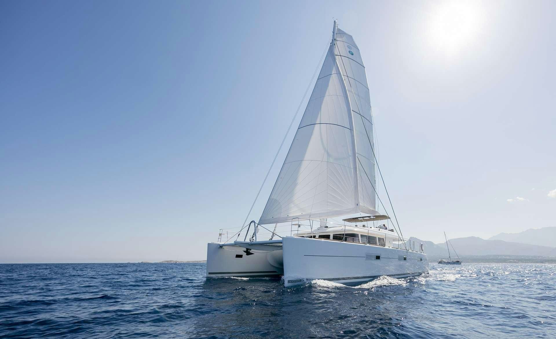 a white boat on the water aboard TWIN Yacht for Charter