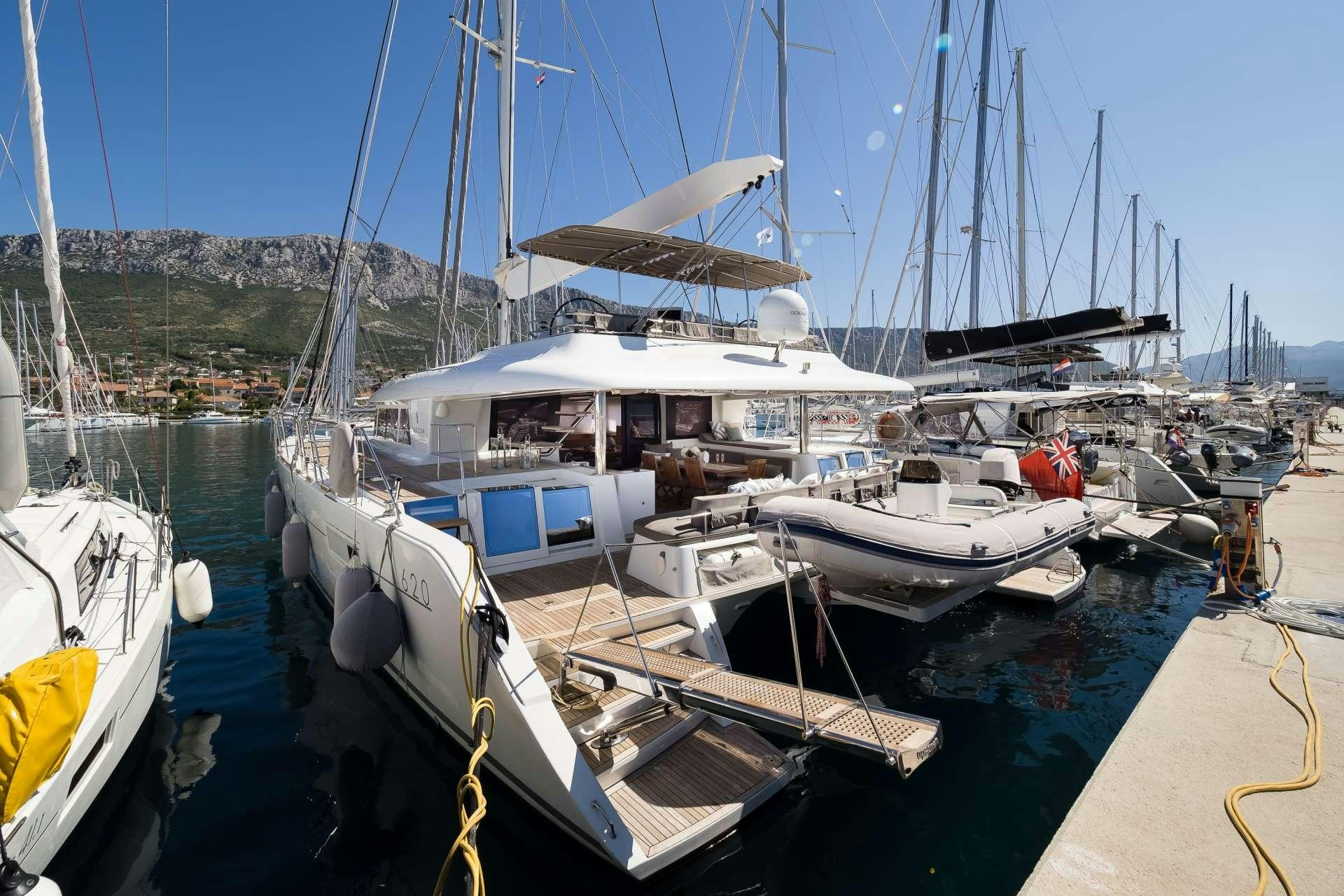 boats docked at a pier aboard TWIN Yacht for Charter