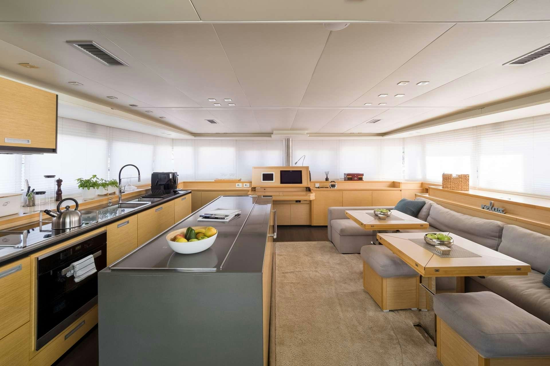 a kitchen and living room aboard TWIN Yacht for Charter