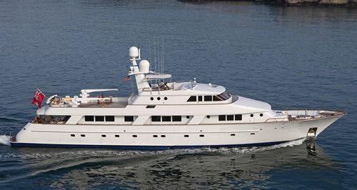 a large white boat in the water aboard RENA Yacht for Charter